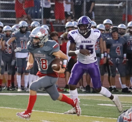 Red Devils Down Purple Riders